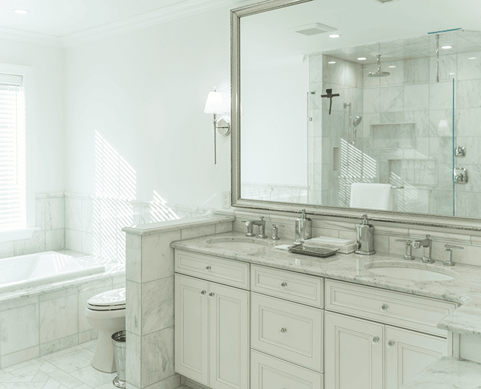 Beautiful luxury high end white Carrara marble bathroom walls, vanity and floors