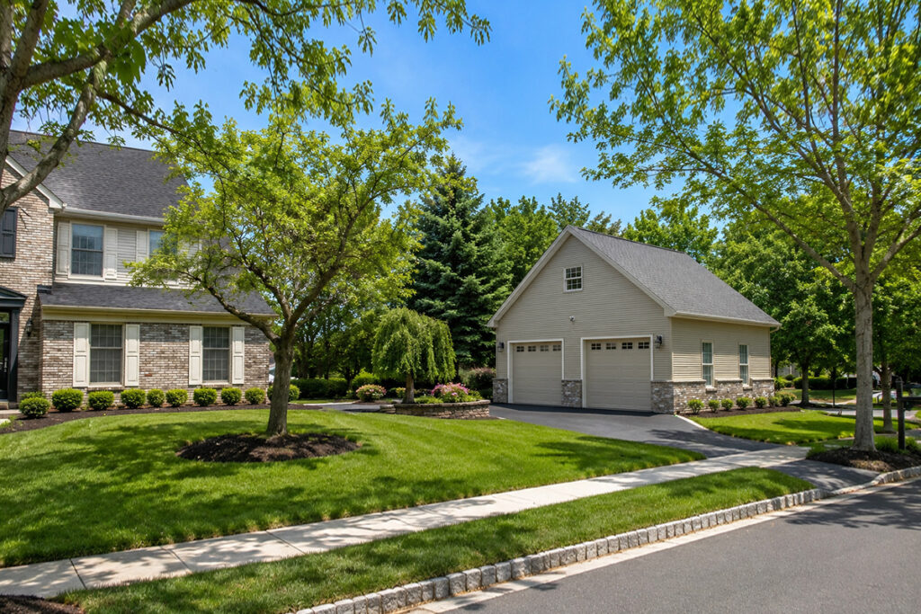 West Windsor luxury new garage construction matches the main home perfectly Tan bricked new luzury garage build in West Windsor, NJ. 28 feet x 28 feet dimensions features 10' ceilings, massive attic storage, heating and cooling and wifi camera door openers.
