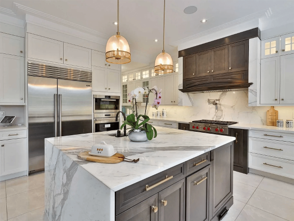 White Kitchen in Monroe with Quartzite Countertops and Island, and Subzero Refrigerator Freezer Combo A high-end luxury kitchen remodeling Monroe project completed in Monmouth County, NJ